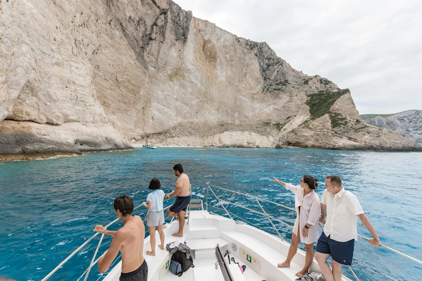 Swimmers in a turquoise cove on the Porto Vromi circuit