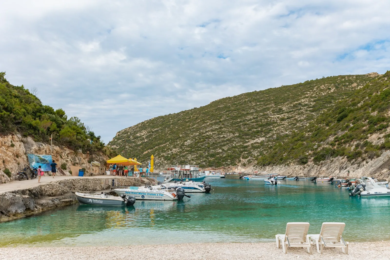 Limestone cliffs above deep blue water near Porto Vromi